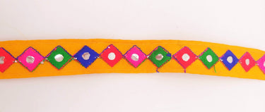 Wholesale Yellow Cotton Fabric Mirrored Trim With Embroidery In Fuchsia Pink, Blue, Red & Green Threads